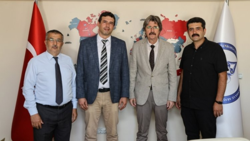 TÜDAM'da bayrak değişimi